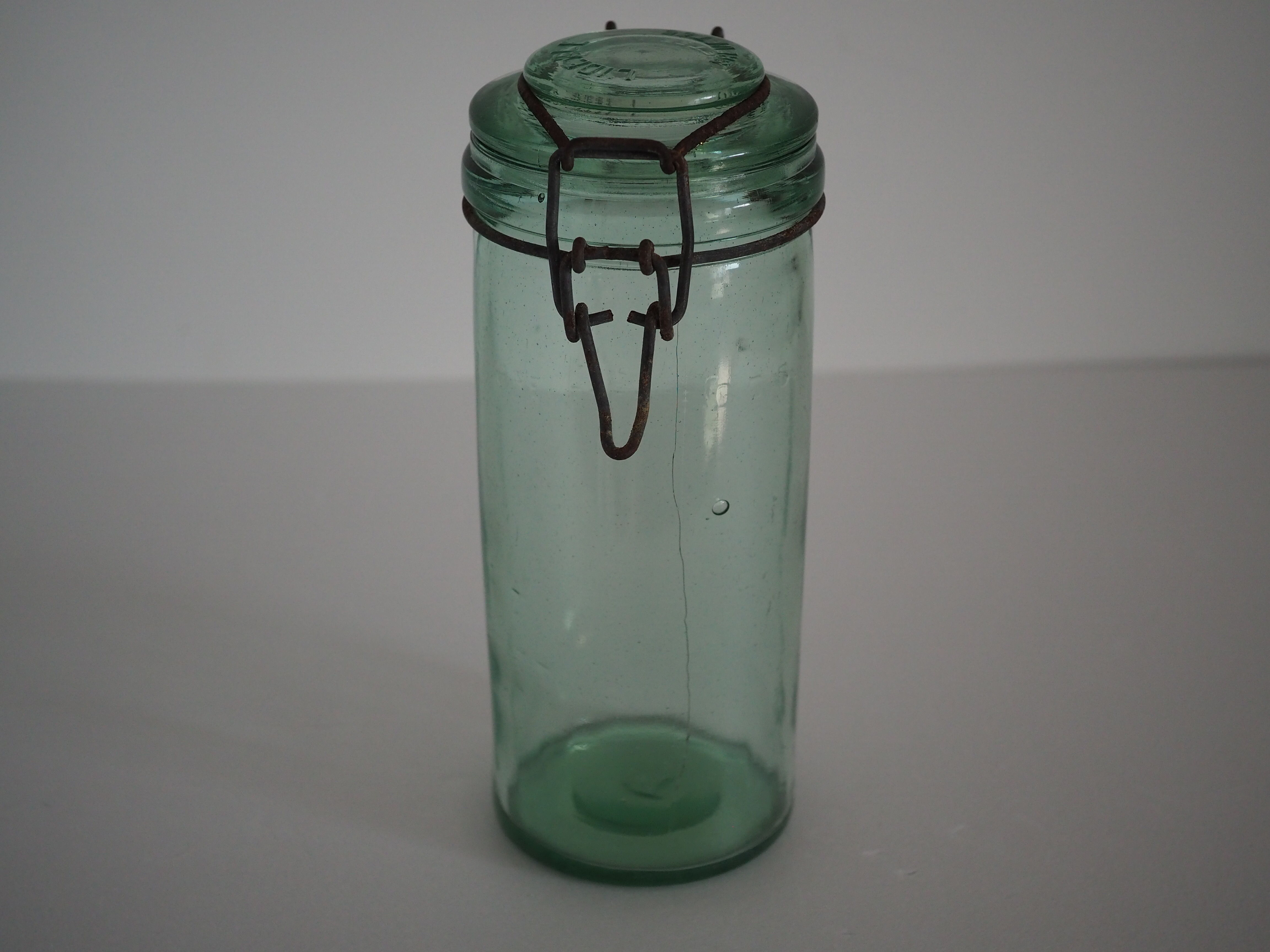 Green "ideale" glass canning jar