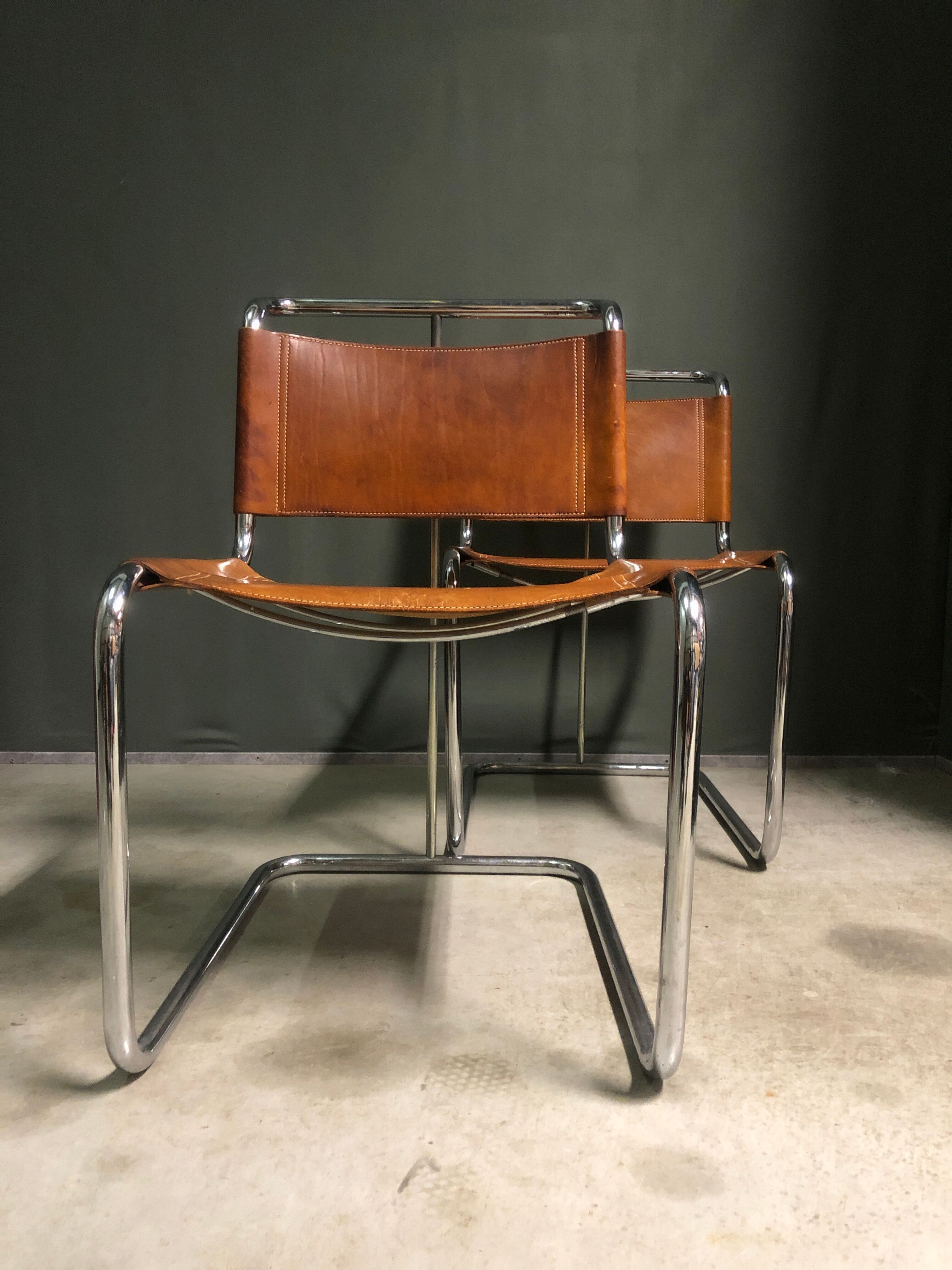 A pair of chromed tubular dining chairs 1980's