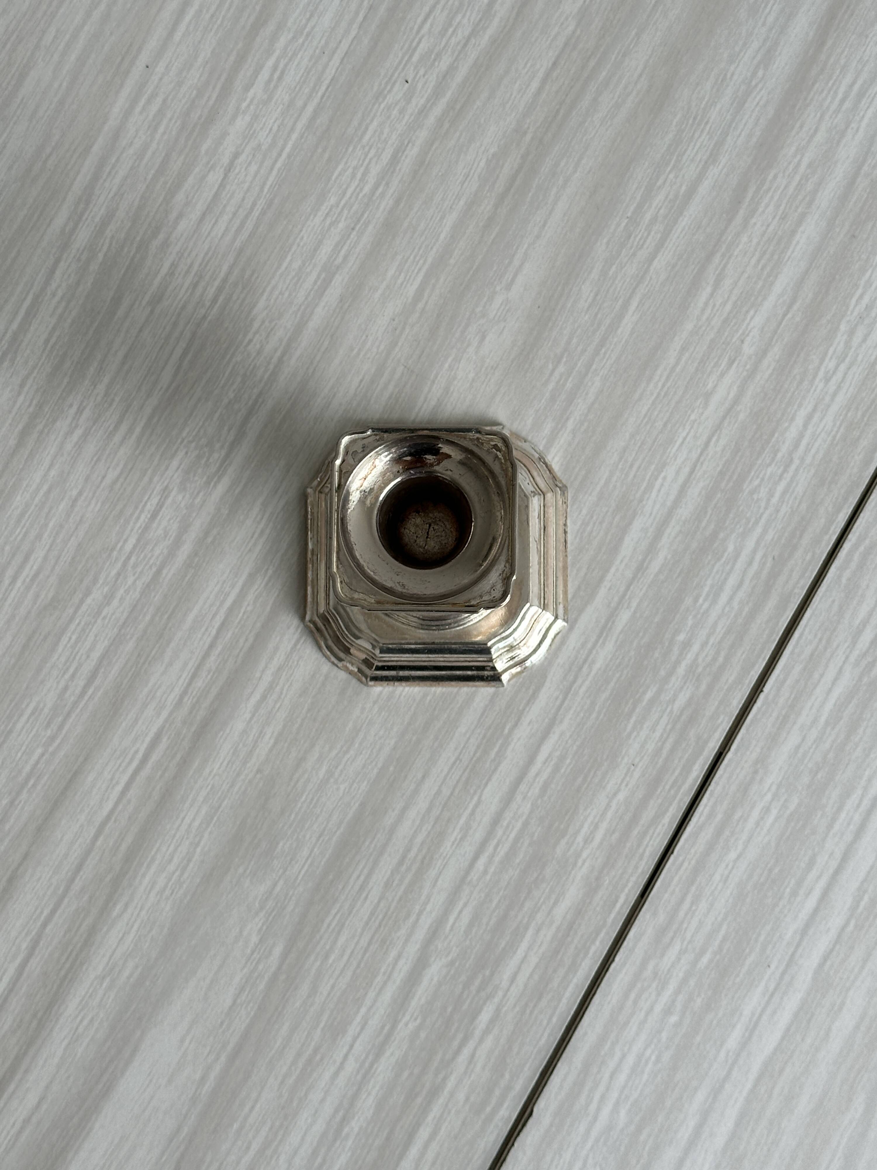 Small antique metal candle holder