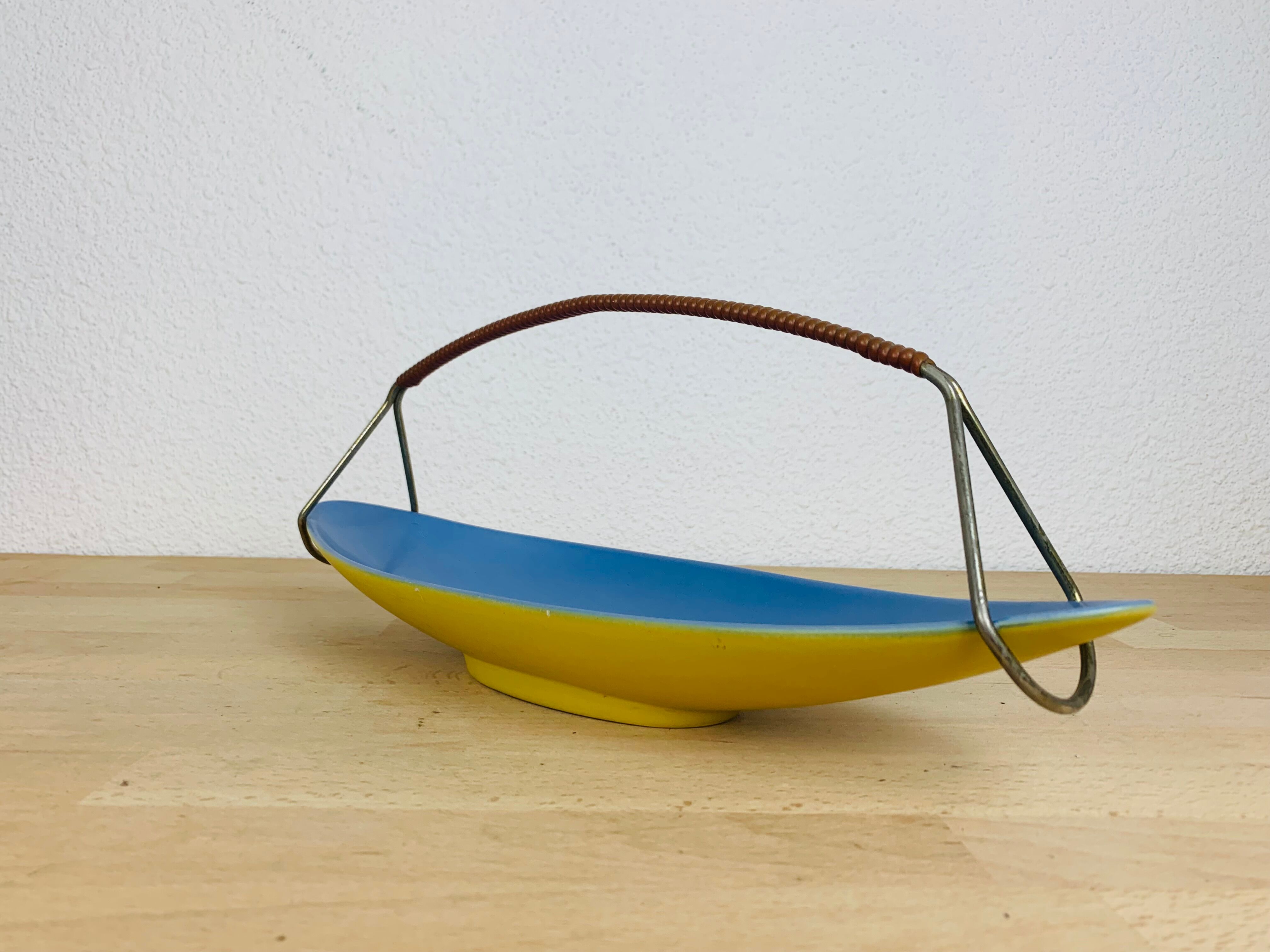 Empty ceramic shuttle pocket from the 50s