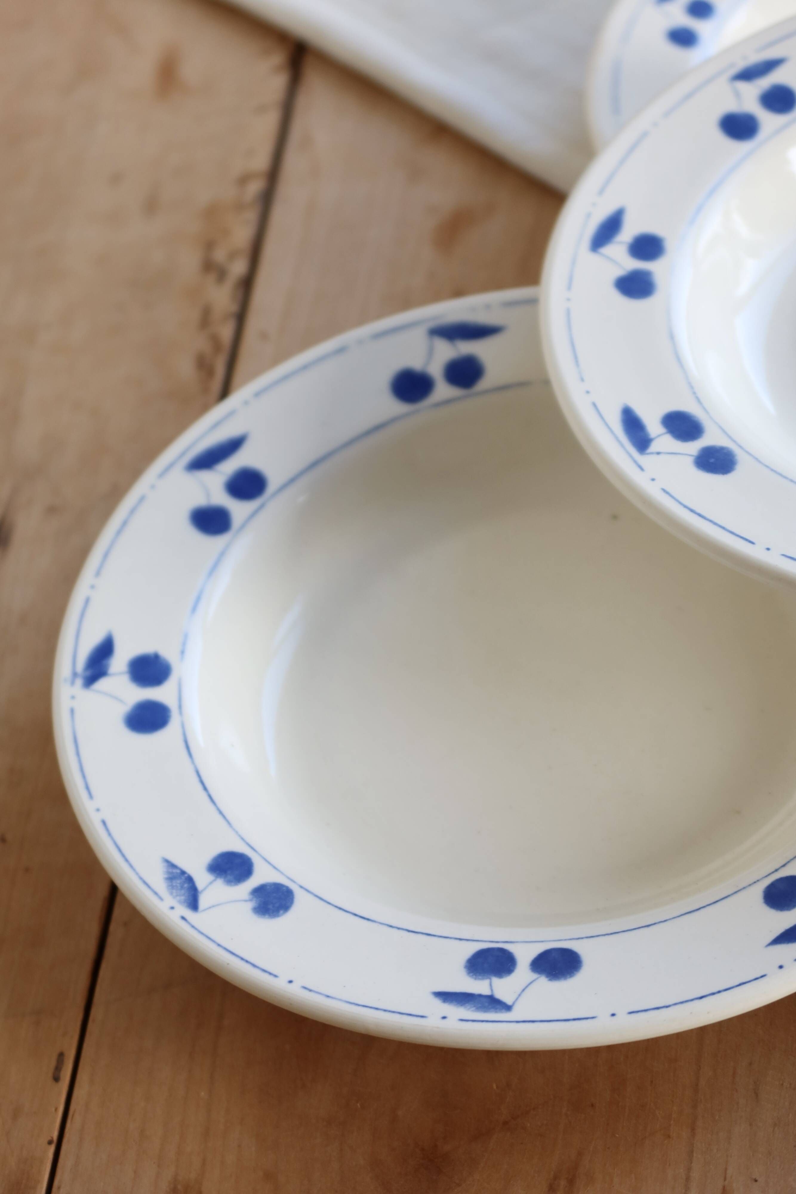 4 vintage deep plates in ivory earthenware with blue cherries