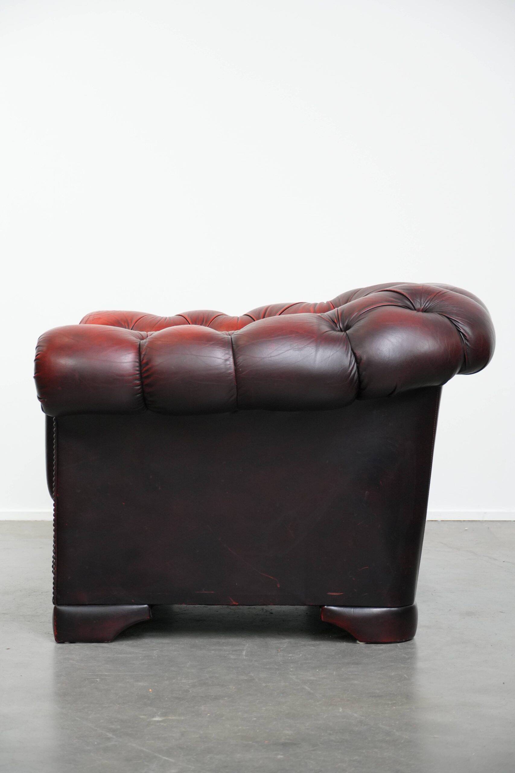 Classic cowhide Chesterfield button seat armchair in a beautiful red colour