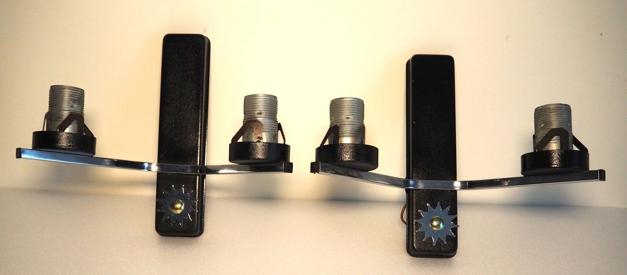 Pair of wall lights from the 1950s-1960s with a push button switch.