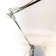 Table lamp of stainless steel and of italian design by Flos