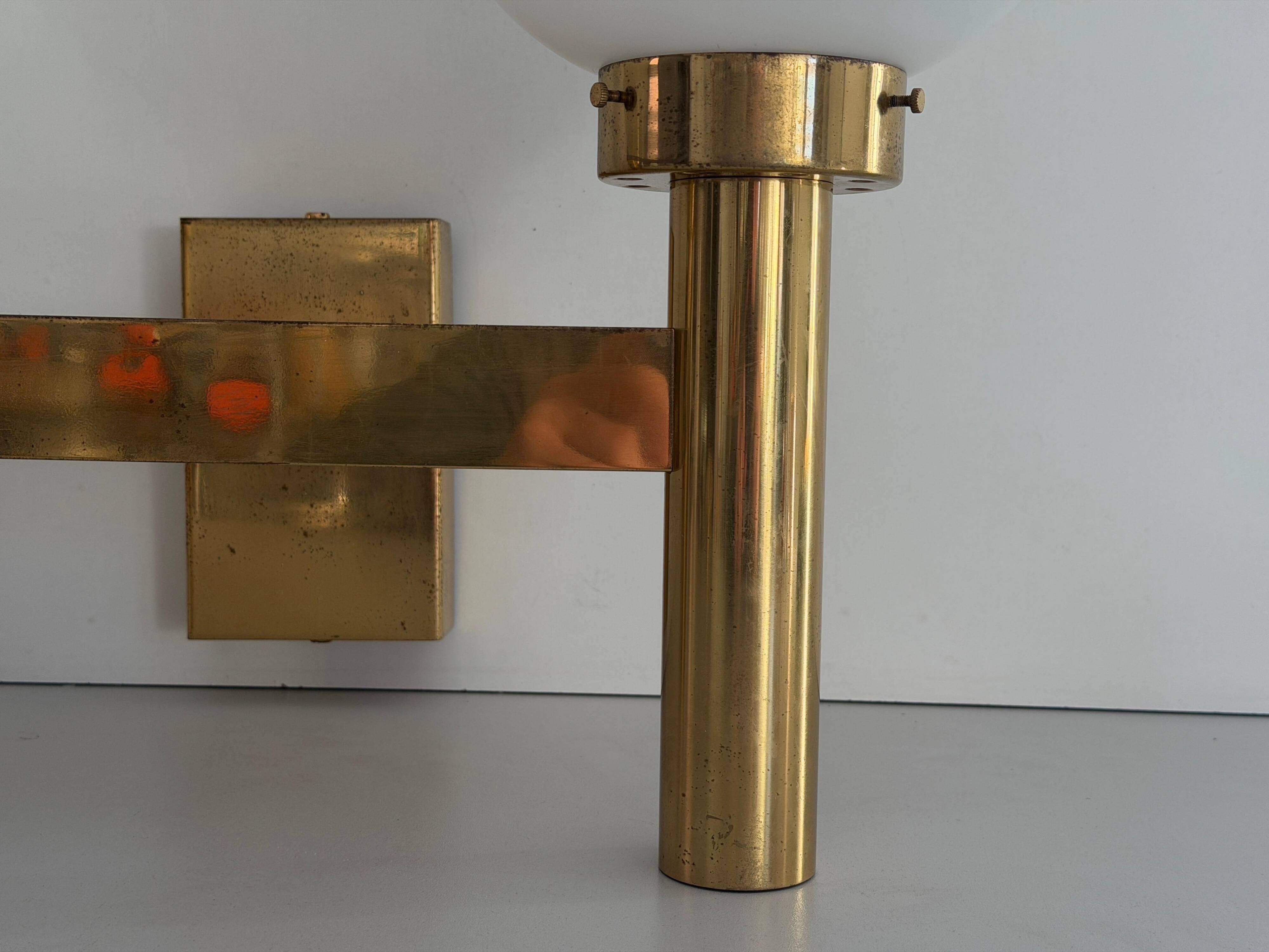Double opal glass and heavy brass, large minimalist cinema wall light, 1960s, Germany