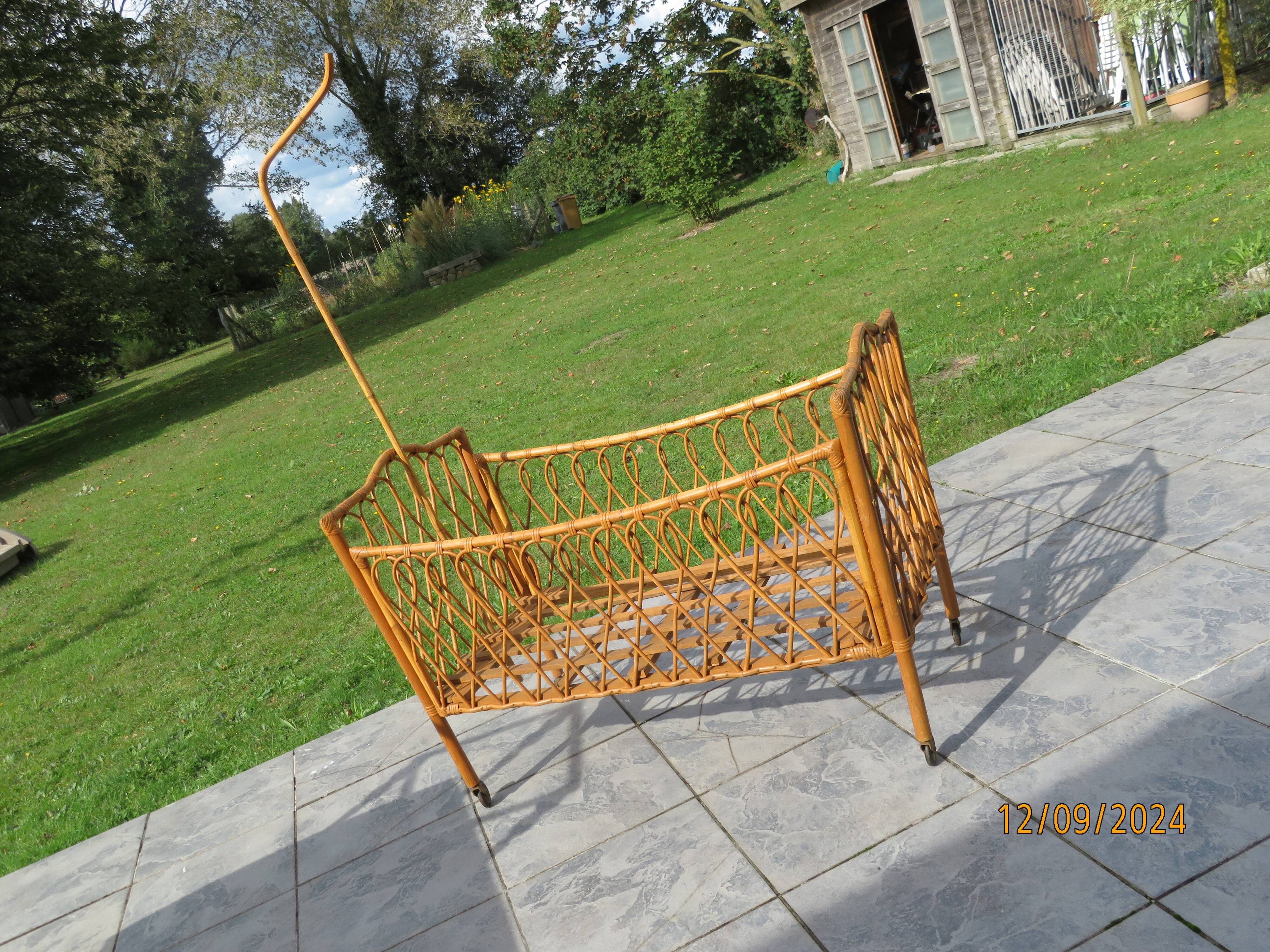 antique rattan children's bed with arrow