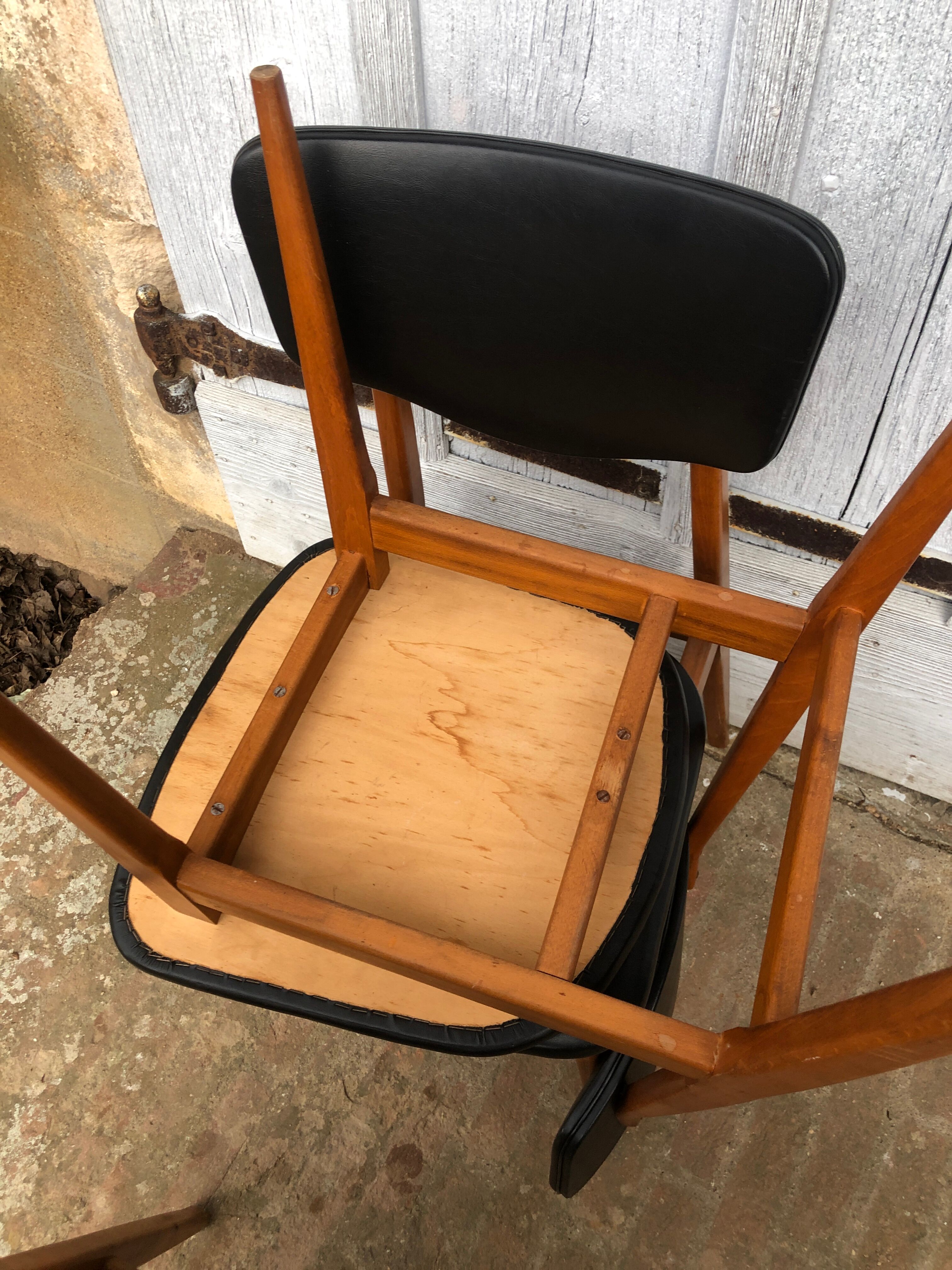Set of 4 Scandinavian teak and black skai chairs