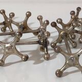 Set de 9 porte-couteaux "Atomium" en métal argenté