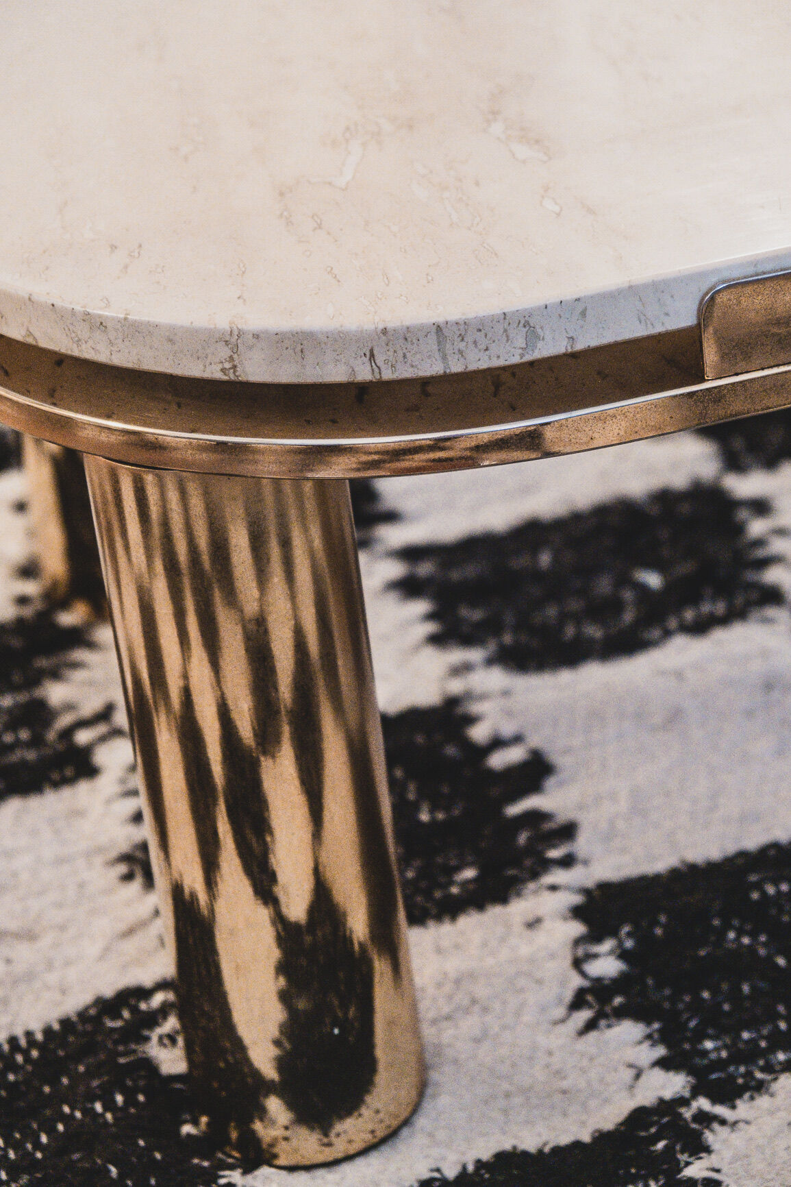 Travertine side table and vintage brass