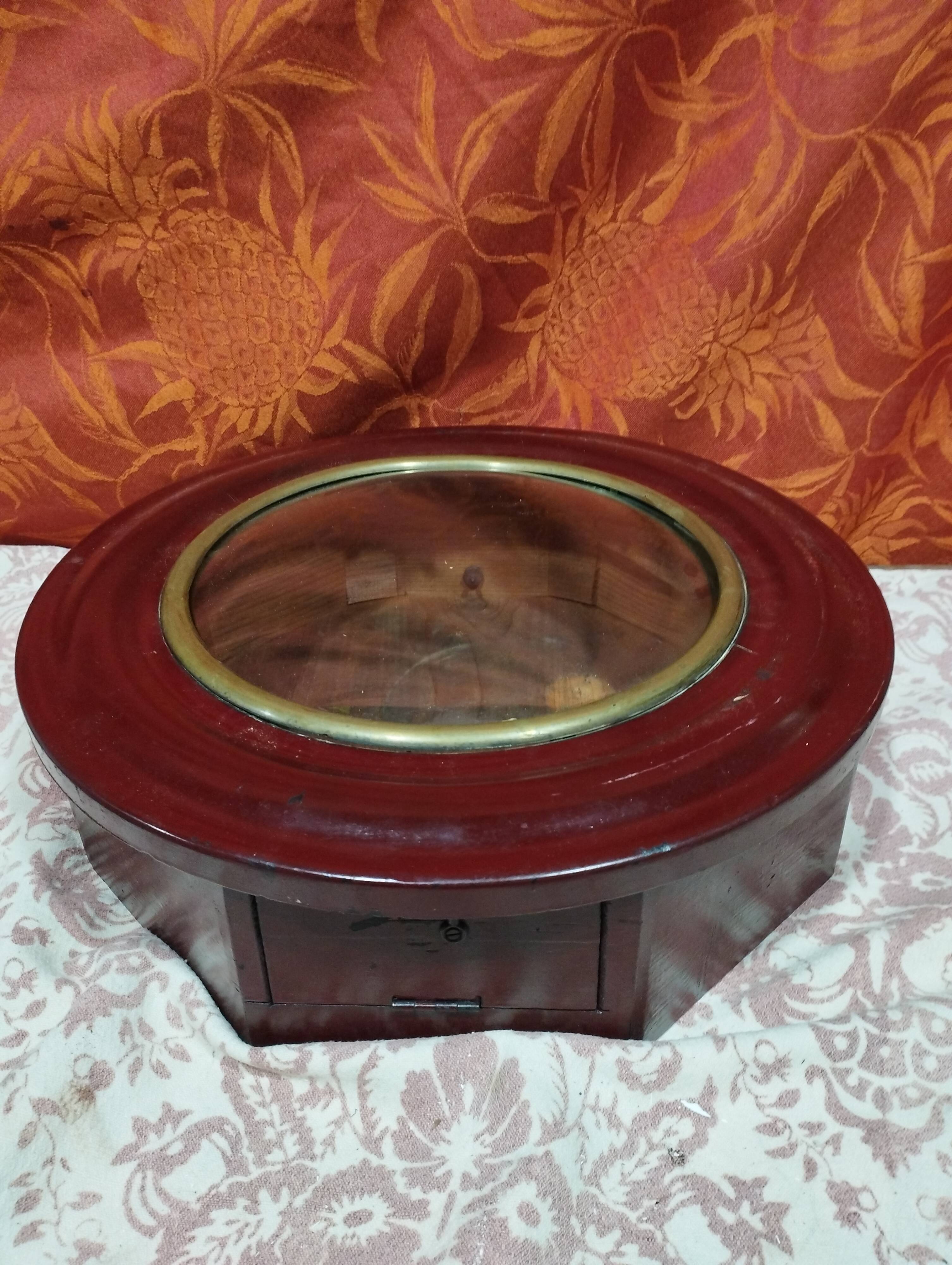 Small round bull's eye wall display case in wood and curved glass