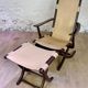 Colonial style leather armchair and ottoman