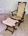 Colonial style leather armchair and ottoman
