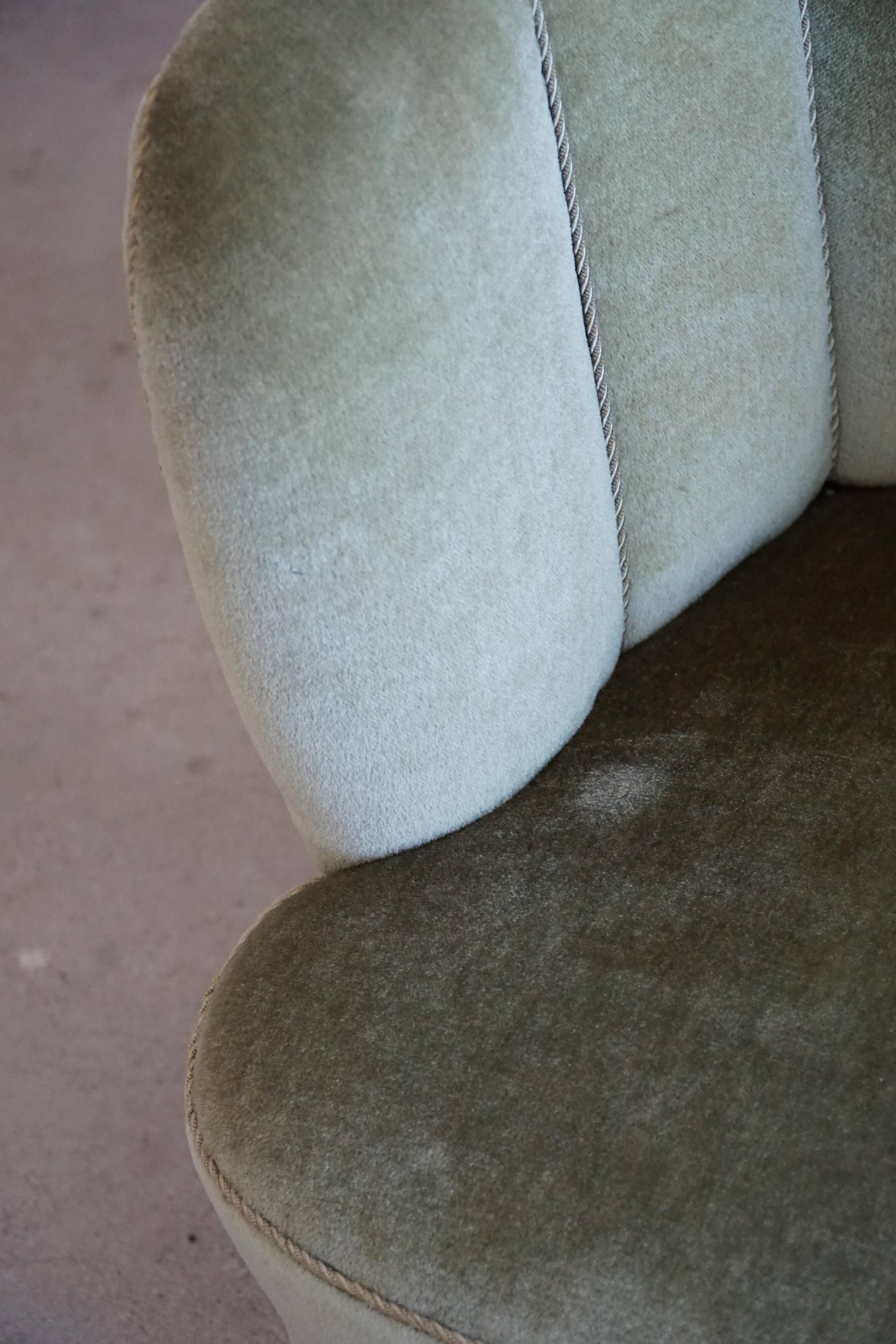 Curved Danish club chair from the mid-century, in the style of Viggo Boesen, 1940s.