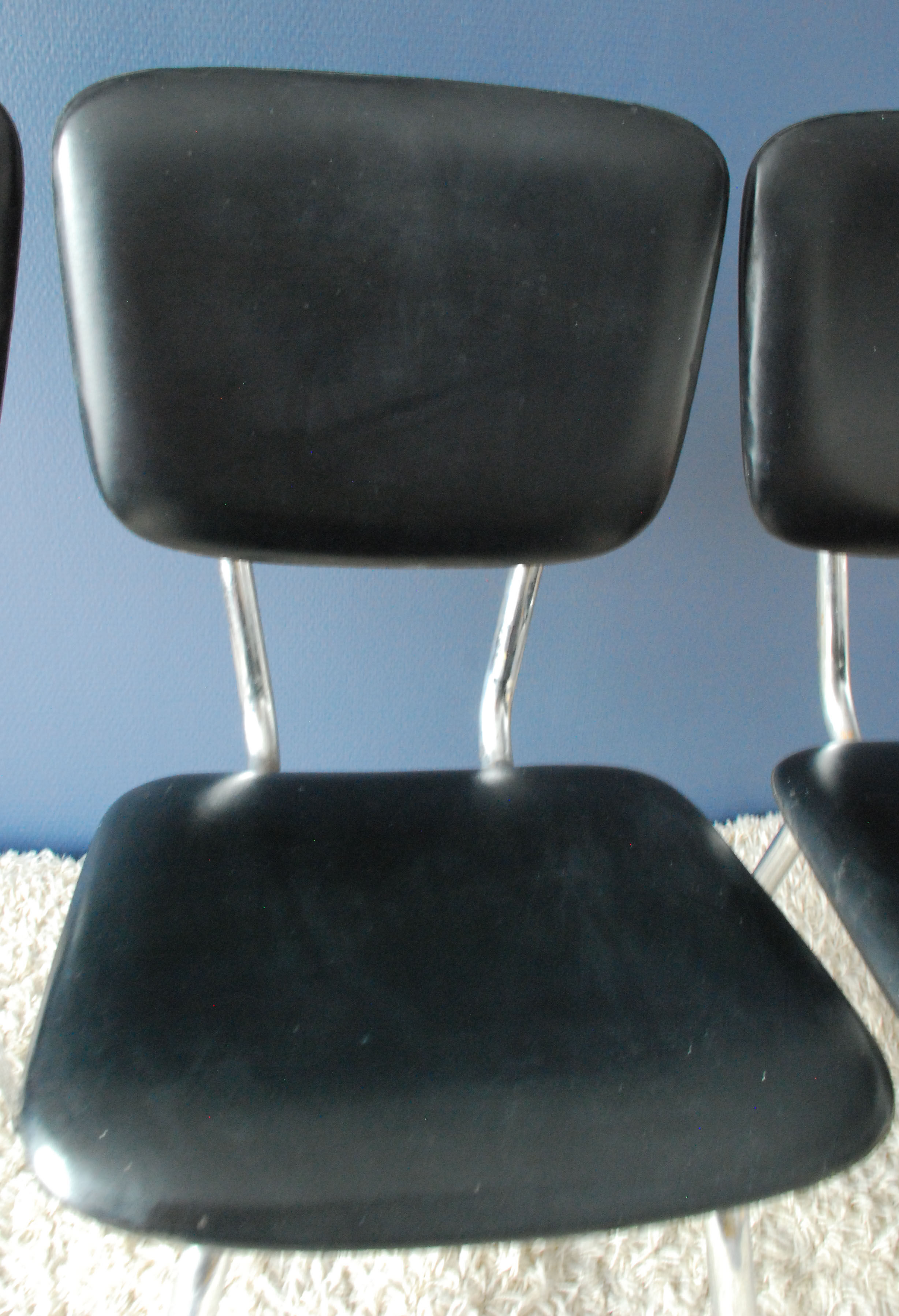 Set of three chairs in black leatherette