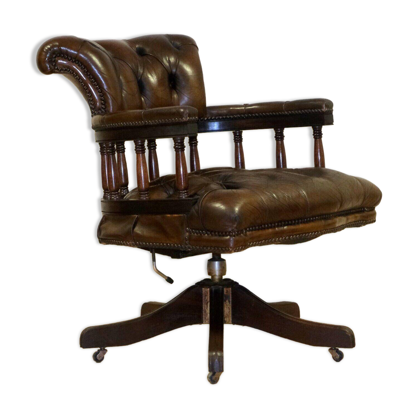 Restored Chesterfield captain's armchair in leather with an oak frame.