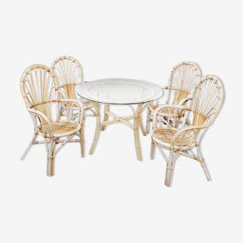 Round table in glass and rattan with 4 rattan armchairs 1960
