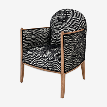 Club armchair in wood and fabric.