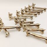 12 vintage silver metal cat knot knife rests