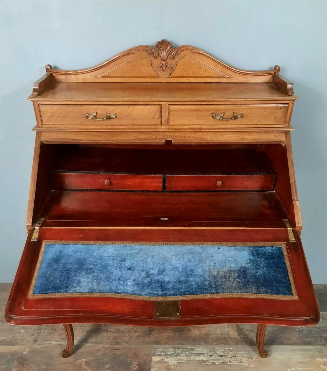 Louis XV style stepped donkey back desk in walnut in early 1900