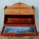 Louis XV style stepped donkey back desk in walnut in early 1900