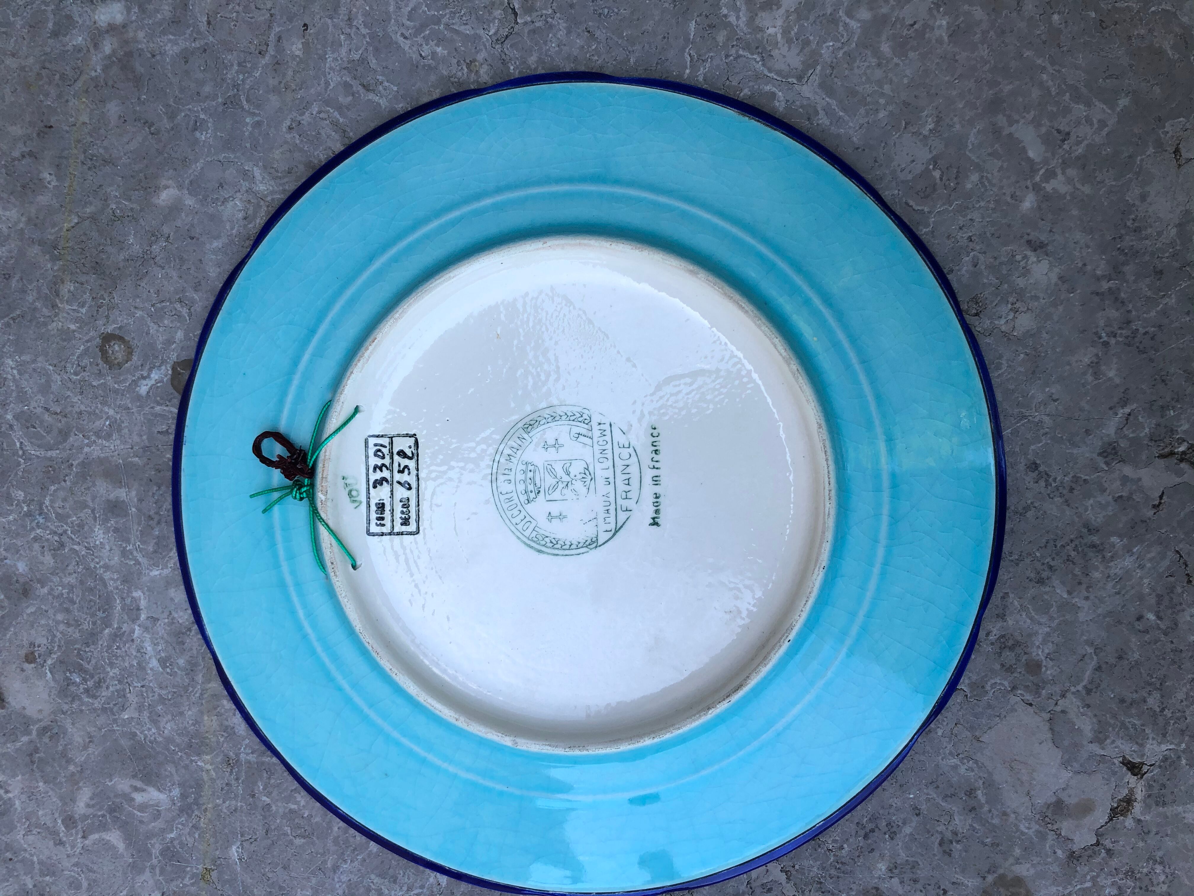 Plate in earthenware has naturalistic décor Longwy emaux