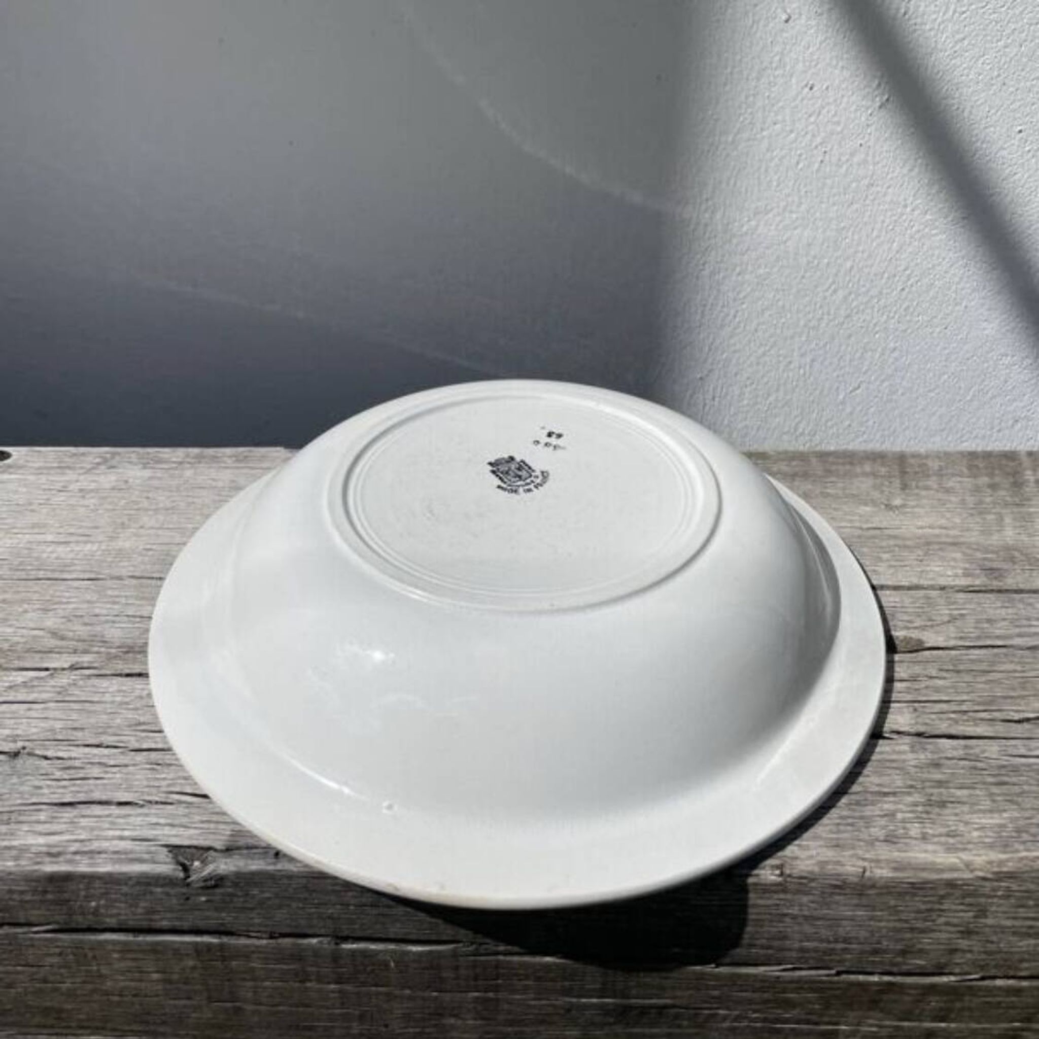 Round, shallow ceramic salad bowl from Saint Amand