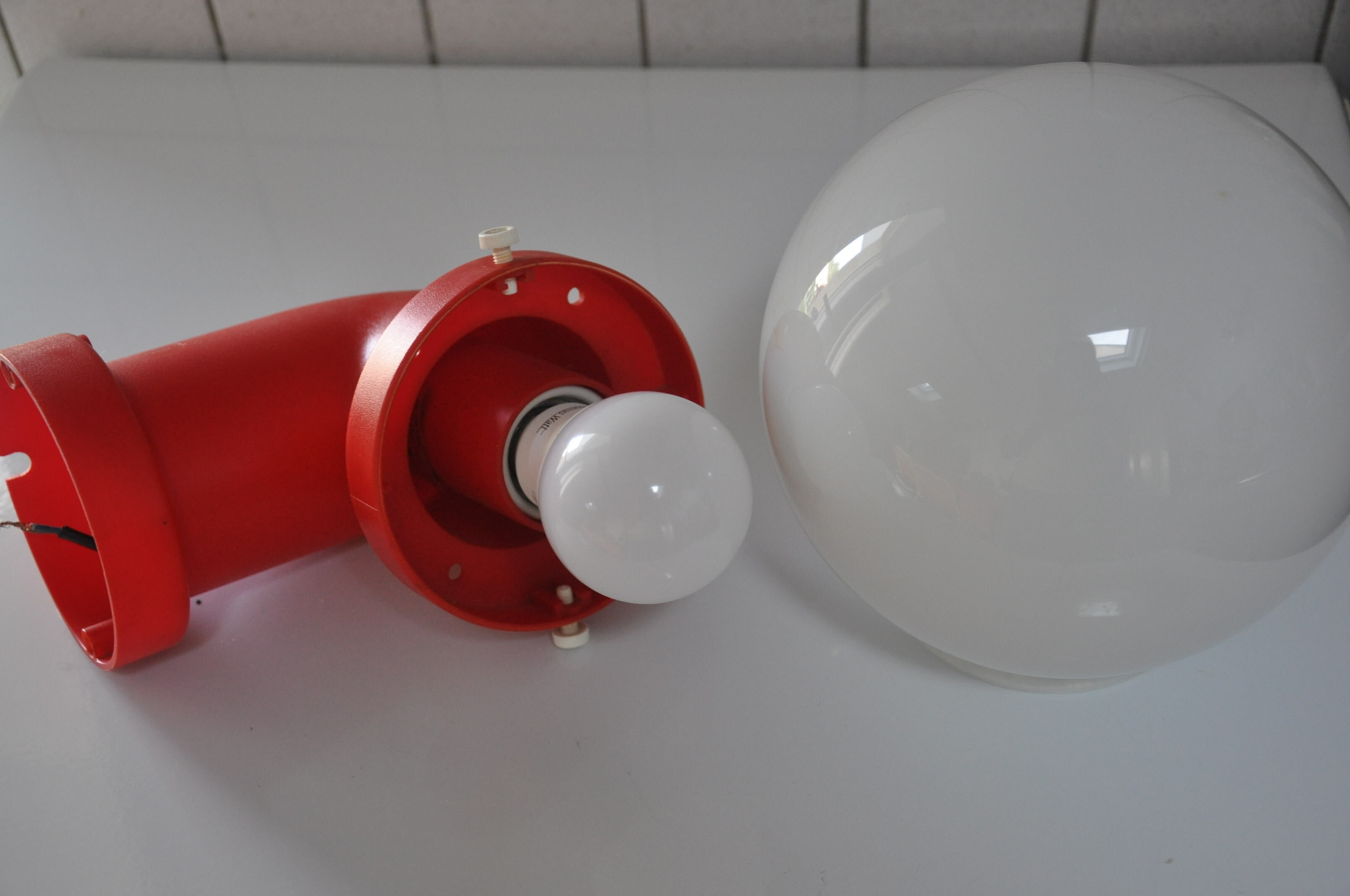 Danish wall light design indus red pipe
