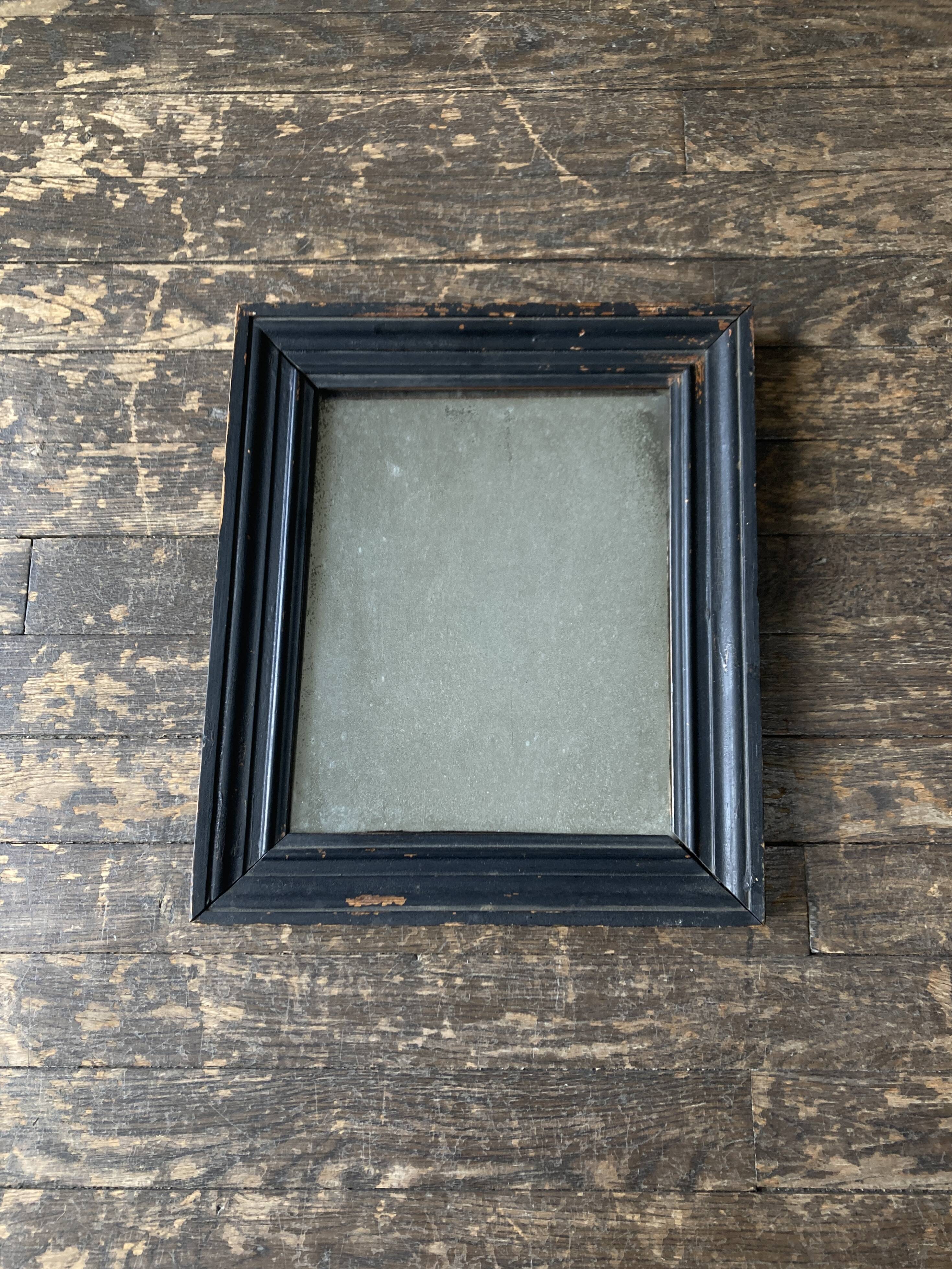 19th century blackened mirror with pitted glass 34cm x 40cm