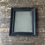 19th century blackened mirror with pitted glass 34cm x 40cm