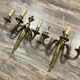 Pair of Louis XVI style gilt bronze wall lights with two light arms, 20th century