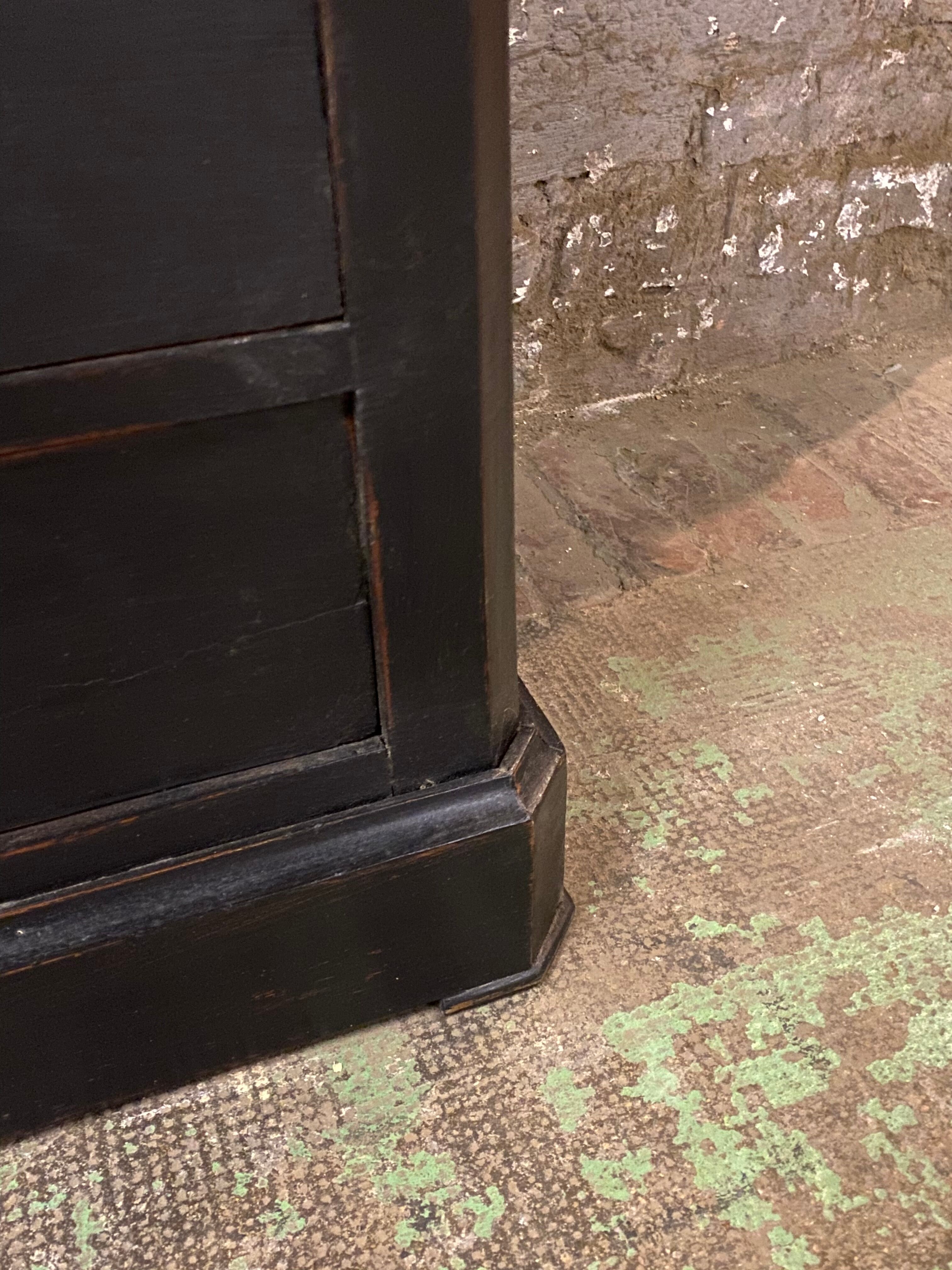 Old black patinated chest of drwers