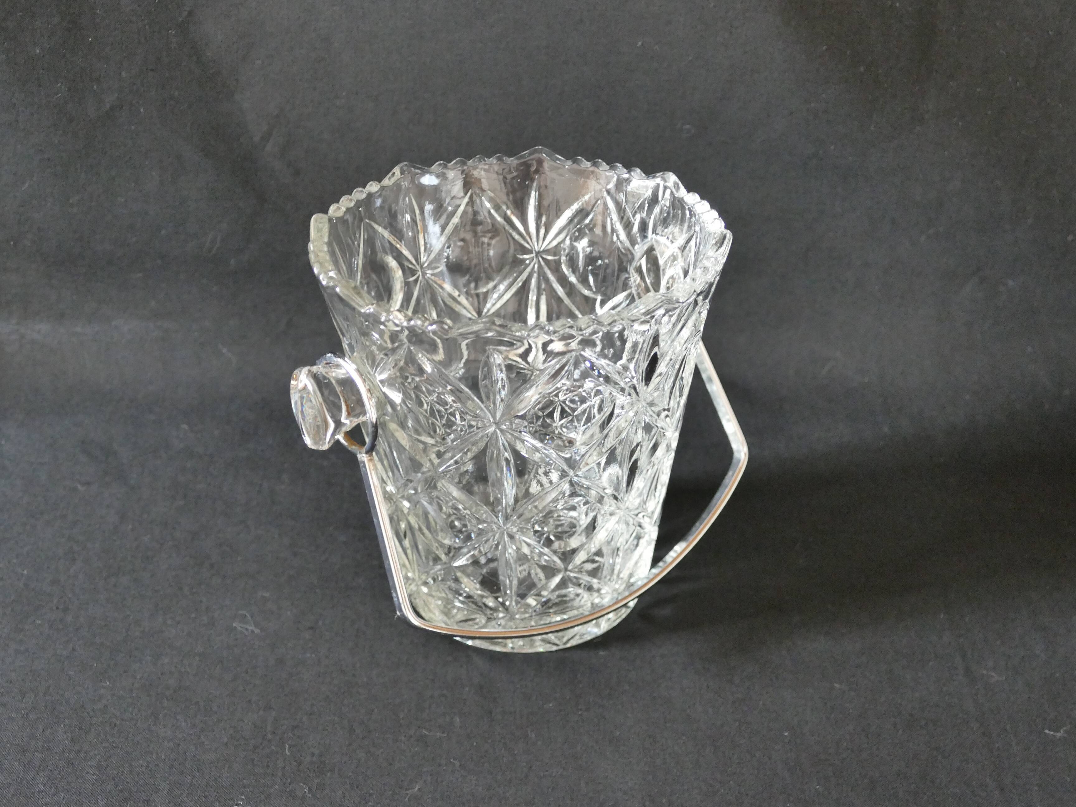 Vintage glass ice bucket stamped with a metal handle