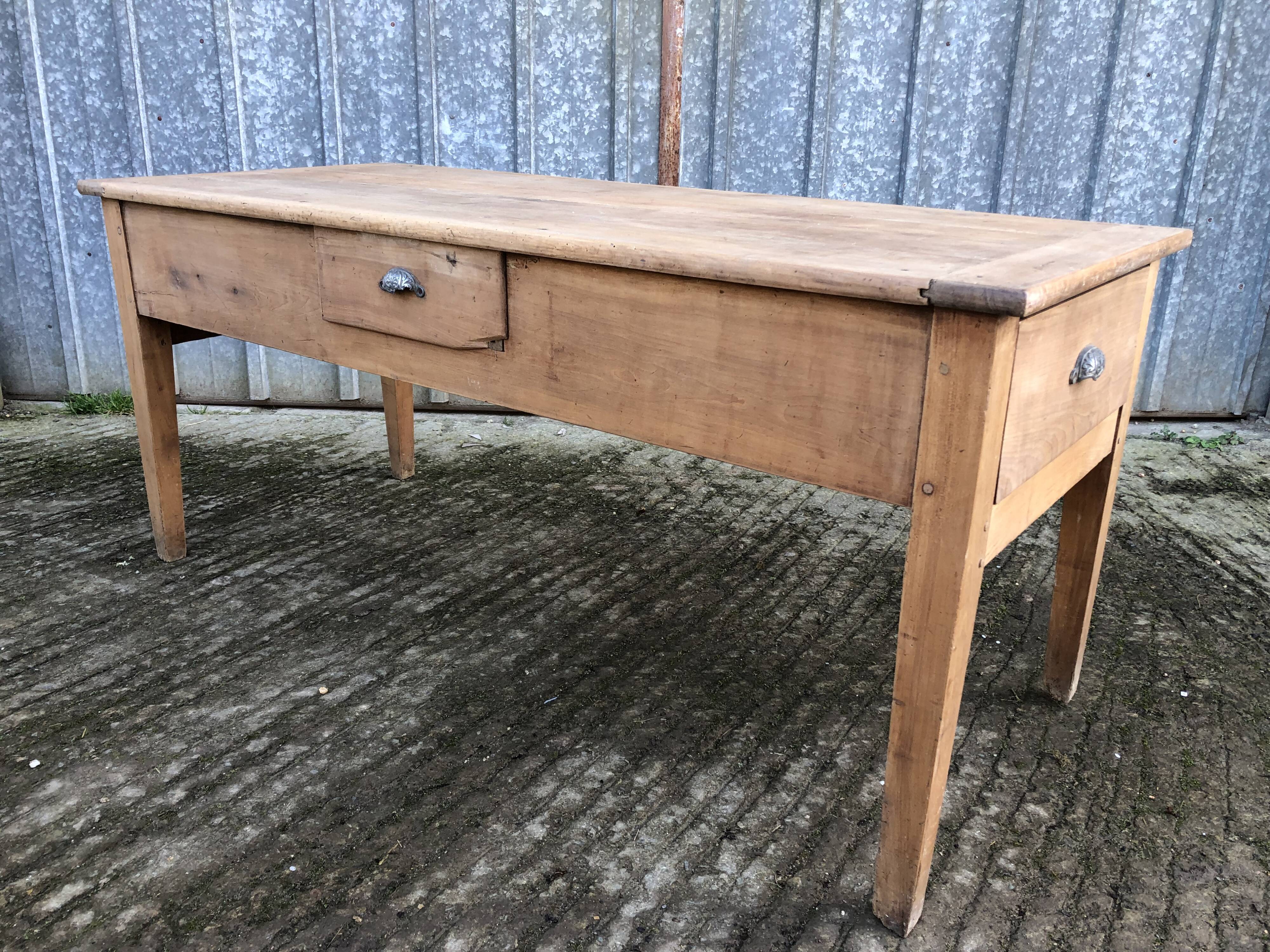 Antique solid cherry farmhouse table with 3 drawers and 1 pull out.