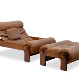 Lounge chair and ottoman, in blond elm and leather. 1970s