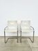 Pair of white moulded shell chairs with chrome tube — Space Age 70s