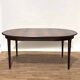 Extendable dining table in Rio rosewood.