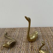 Family of brass swans of the 70s