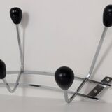 Chrome wall-mounted coat rack