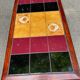 Solid wood and multicoloured ceramic coffee table from the 1970s.