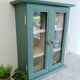 Green and beige 2-door wall display case