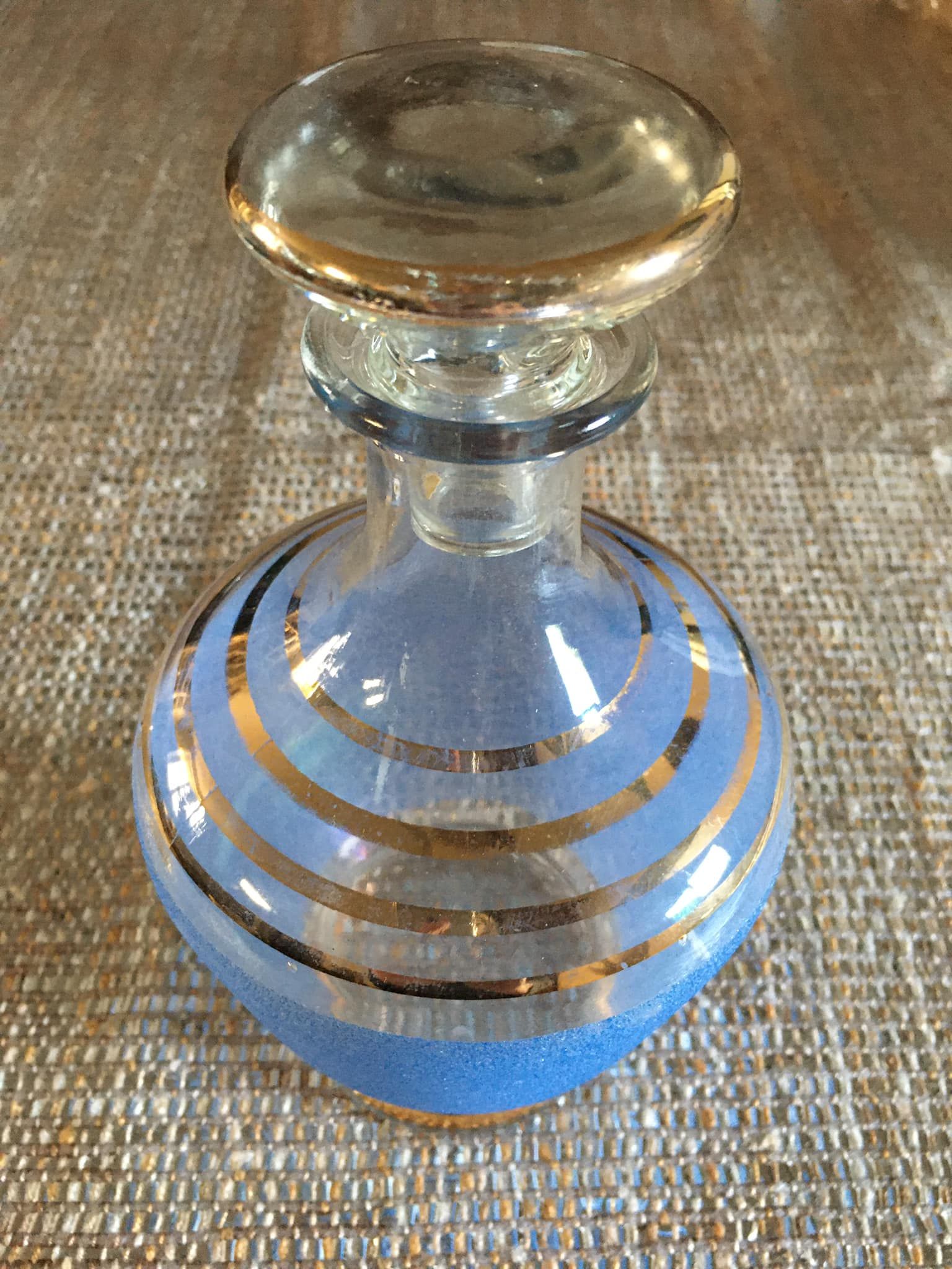 Antique carafe in blue granite glass and gilded edging