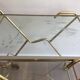 Italian designer rolling table in brass and engraved glass