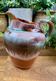 Old ceramic jug with glazed finish – flame decoration