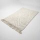 Small Moroccan rug with white diamonds.