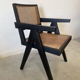 Black wooden armchair with caning