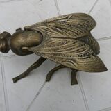Old brass ashtray in the shape of a fly