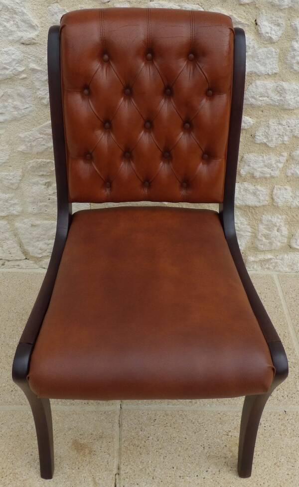 Chic Vintage Chesterfield style chair with wooden frame and faux leather