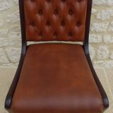 Chic Vintage Chesterfield style chair with wooden frame and faux leather