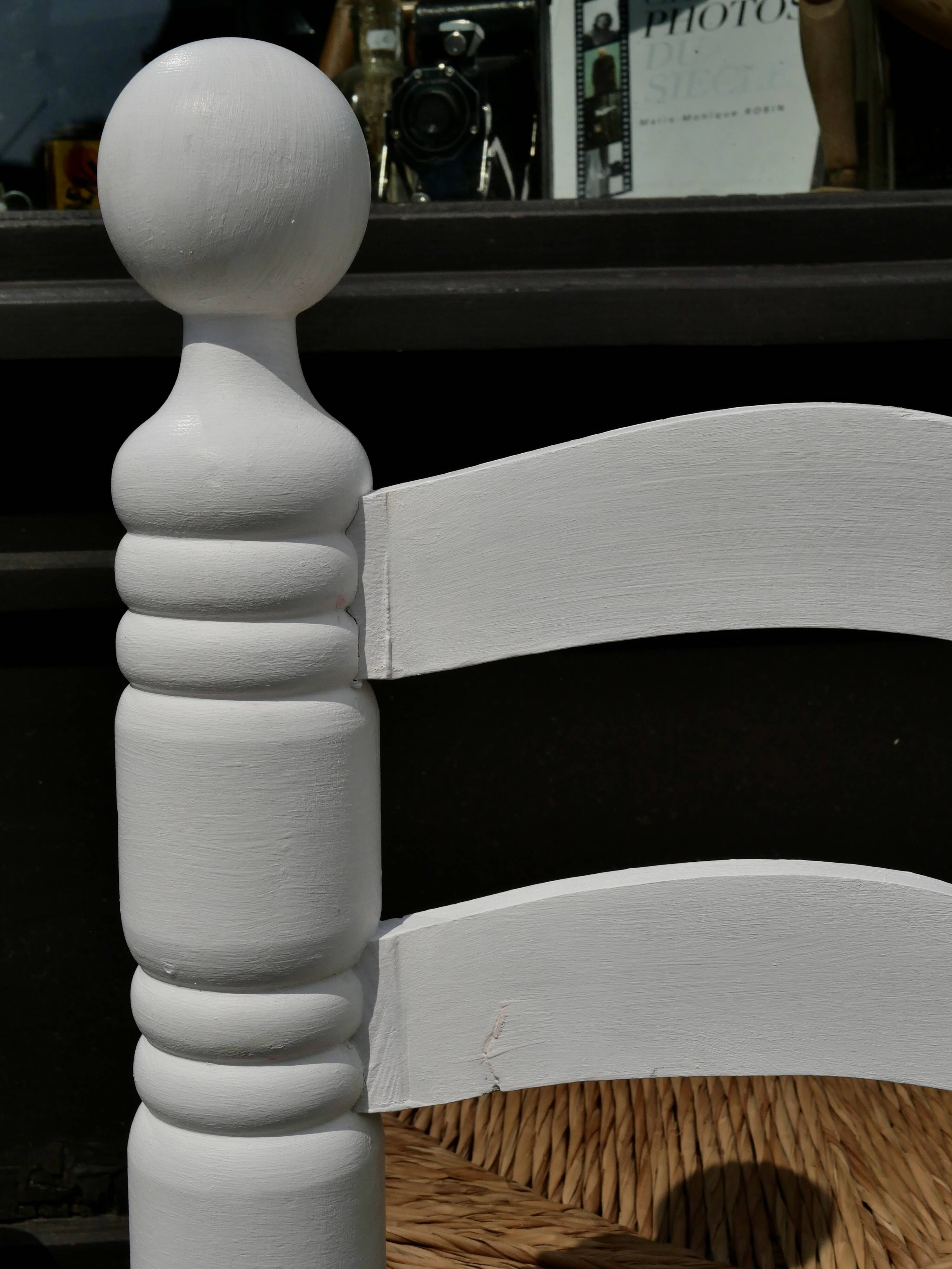 Pair of rush-seated chairs by Charles Dudouyt