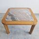 Brutalist coffee table in solid oak with a Rosso Luana marble top.